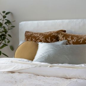 Two-tone floral embroidery on sumputuous silk velvet on the front and Tencel™, a sustainable textile, are joined for beautiful shams to dress the headboard. 