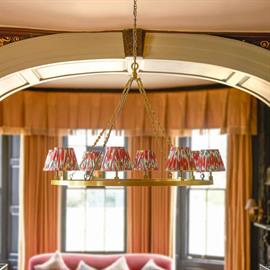 Larger halo chandelier for 8 shades in antique brass